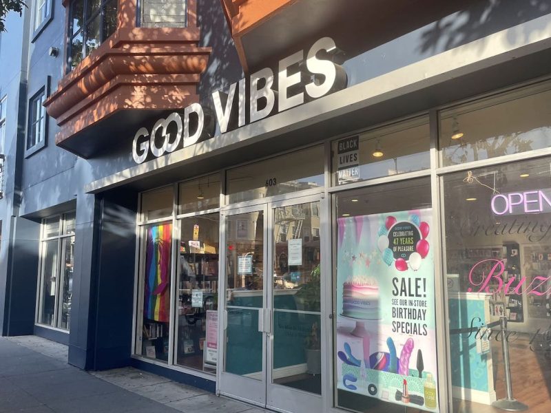 A storefront with a sign that says good vibes.