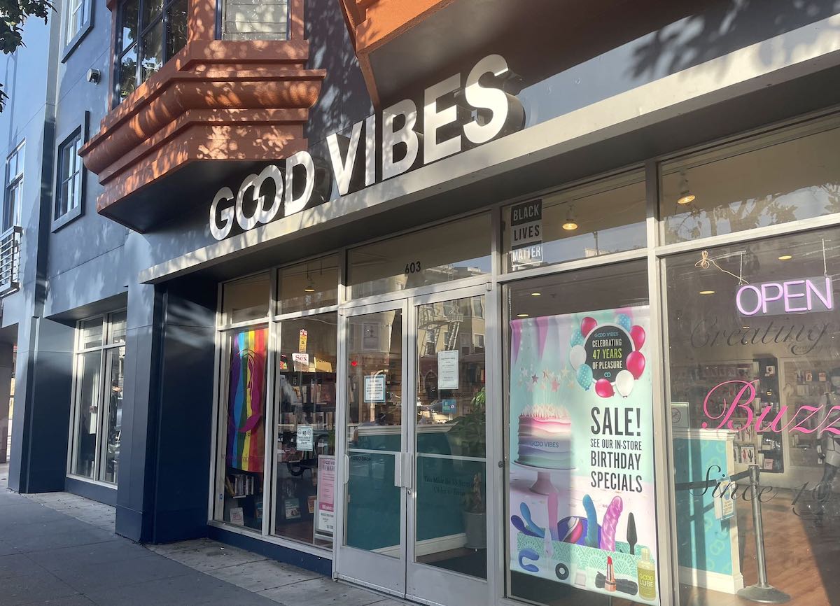 A storefront with a sign that says good vibes.