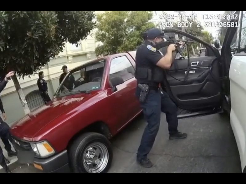 San francisco police officer tries to stop a car in san francisco.