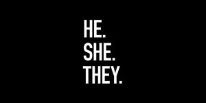 A black background with the words he, she, they.