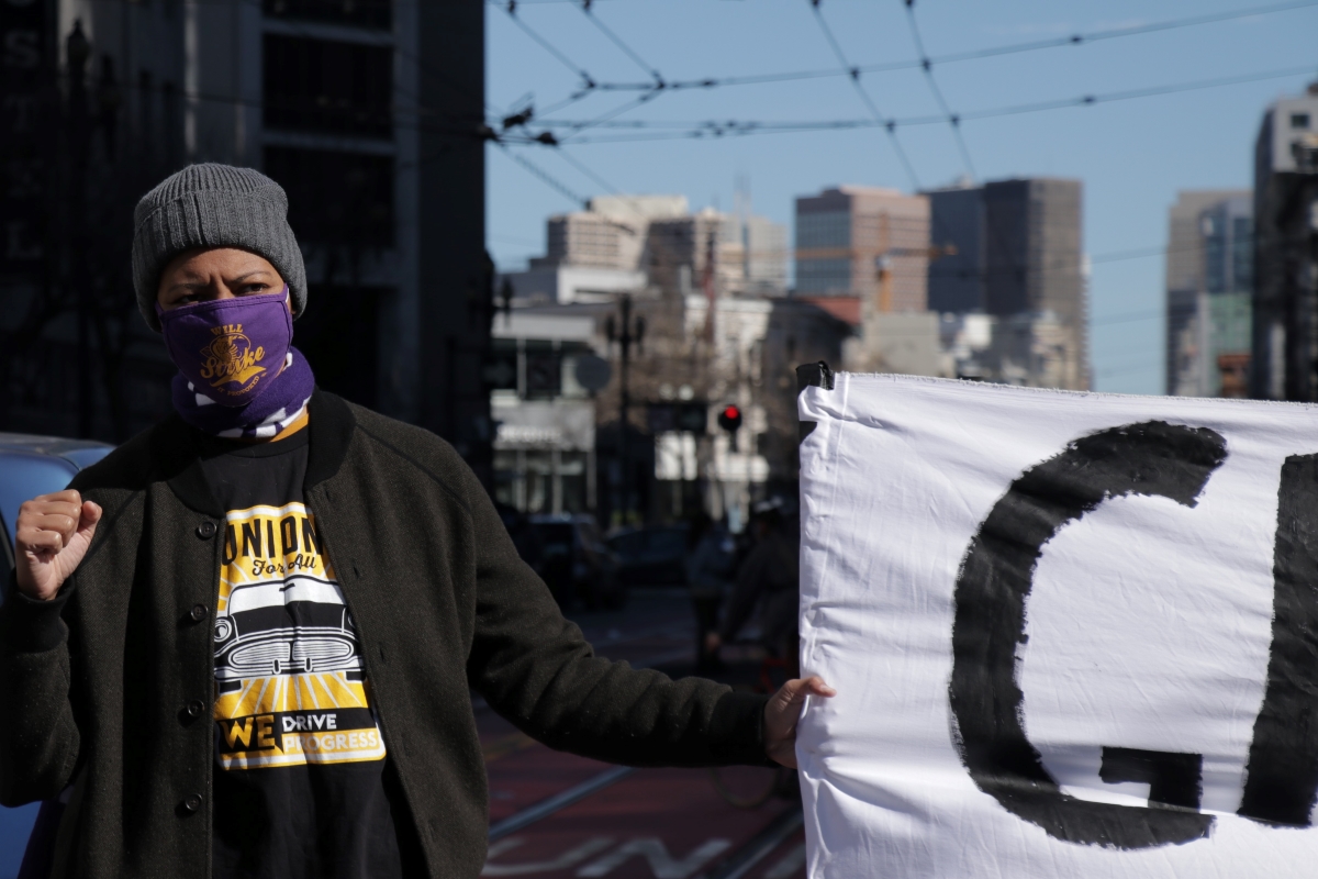 Jennifer Esteen and other members of SEIU 1021 temporarily shut down a section of Market Street on Feb. 17, 2021 to advocate for paid personal protective equipment for gig drivers. Photo by Juan Carlos Lara