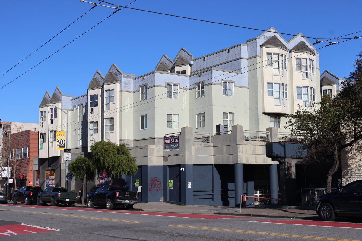 An apartment building on a street in san francisco.