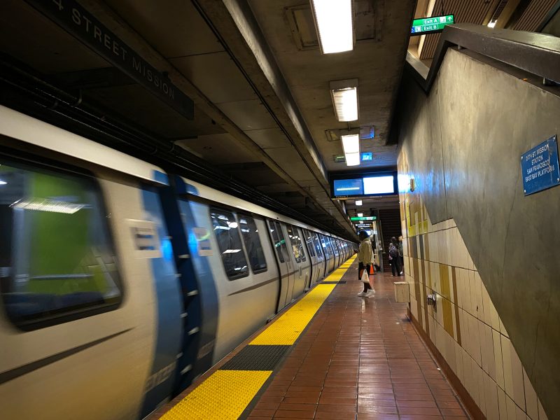 A BART train arriving at 24th Mission station.