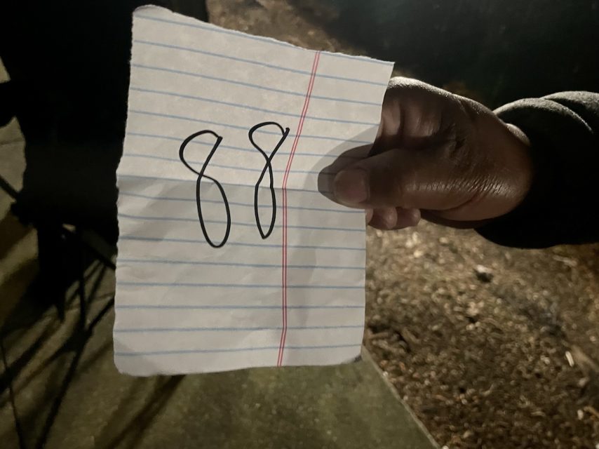 A piece of paper with 88 written on it