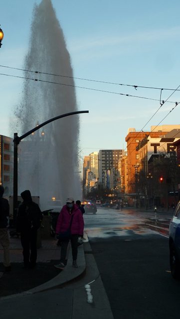 A fire hydrant is spraying water.