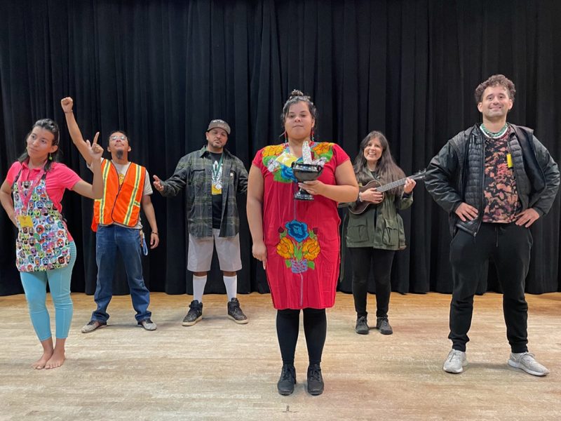 A group of people standing on a stage.