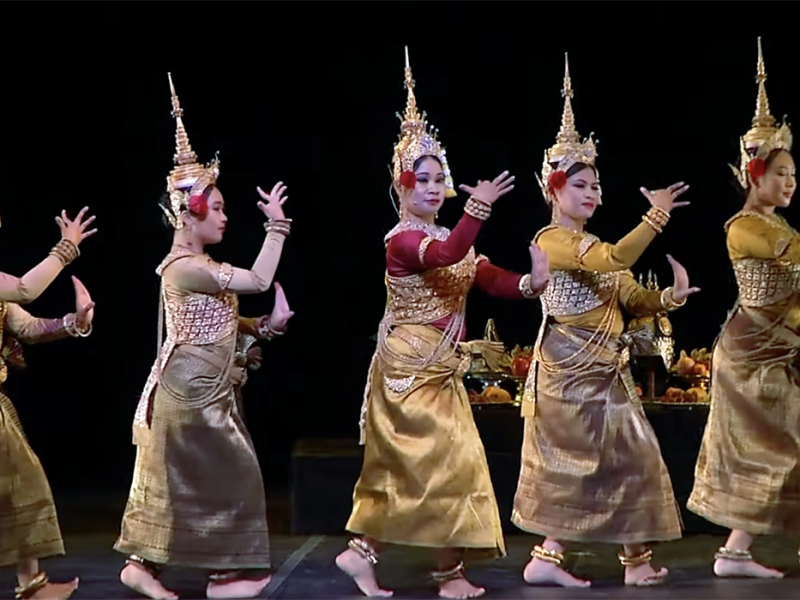 Four thai dancers performing on stage.