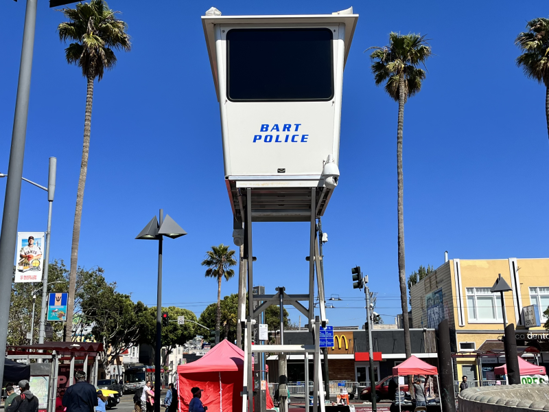 A white collapsible structure with the words BART Police visible on the side.