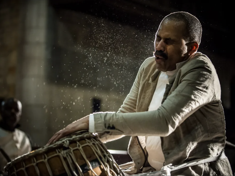 A man playing a drum.